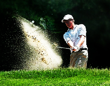 Golfer Jumping For Joy In Dramitic Hole Setting